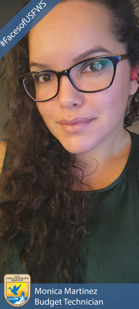 A woman wearing a dark green shirt and black glasses. A banner in the top left corner says "#FacesofUSFWS". The USFWS logo appears in the bottom left corner. A banner across the bottom reads "Monica Martinez, Budget Technician".