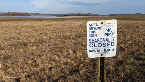 Seasonal area closed sign in front of a sanctuary area of refuge.