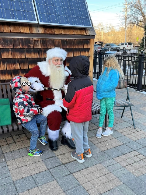 Santa talks with children at DC Booth hatchery