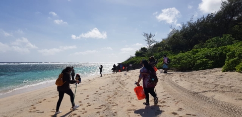 Volunteers cleaning up Ritidian Beach at the Guam National Wildlife Refuge