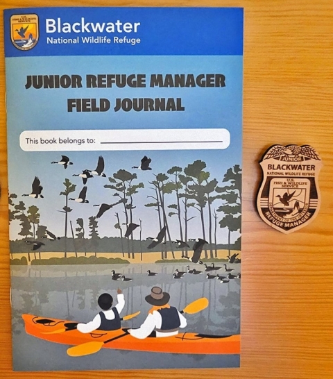 Picture of Blackwater's Junior Refuge Manager Field Journal and badge