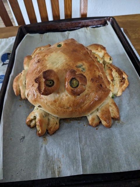 A loaf of bread baked and shaped in the form of a frog