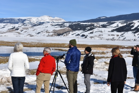Winter naturalist Joe Lieb (third from the left) leads visitors on a wildlife watching excursion on National Elk Refuge. Photo Credit: Gannon Castle