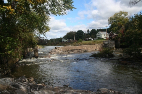 Photograph looking upstream to the partial breached Upper Town Dam from Webster Road Bridge.