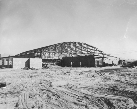 Ground level view of hangar under construction. 
