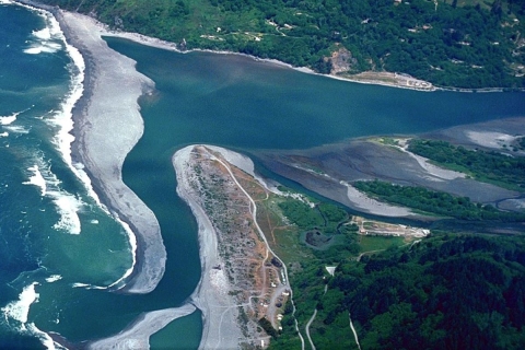 aerial view of river entering ocean