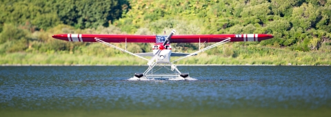 a small floatplane on a lake