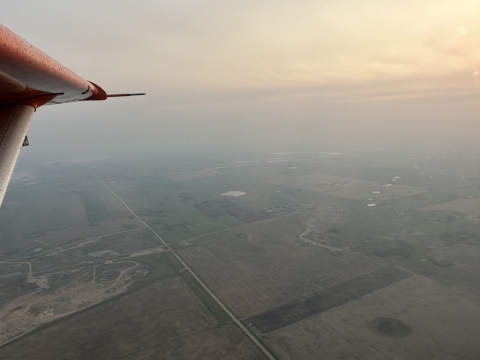 airplane view of forest fire smoke filling the air