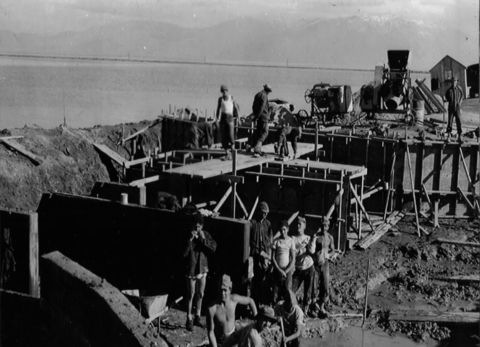 Circa 1930s photograph of men working on water control structure at Bear River Migratory Bird Refuge