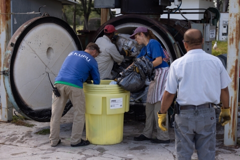 The "PHATT" Team meticulously manages island trash, here delivering it to the incinerator, to eliminate alternate sources of food that may distract mice from bait.