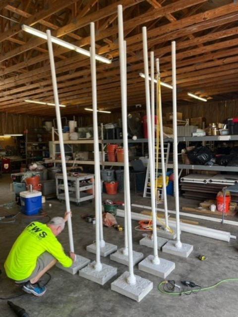 Adam Kaeser constructing array in warehouse.
