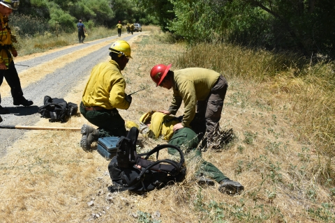 Firefighters tend to a patient during a medical practice scenario at San Luis Refuge Complex