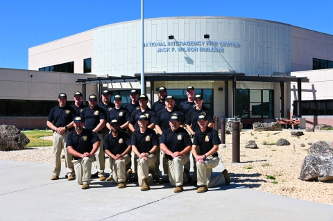 The honor guard poses as a group in front of the National Interagency Fire Center.