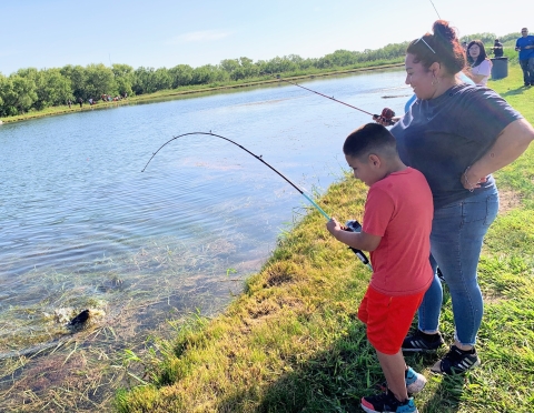 Reeling in a channel catfish at Uvalde National Fish Hatchery