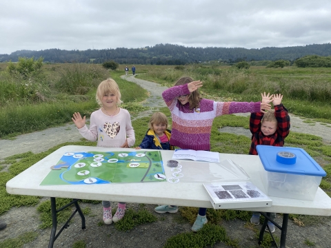 A group of children celebrating their results in the restoration activity in the Junior Conservationist Day.