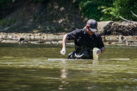 University of Southern Mississippi Geneticist Ryan Lehman samples water from Strong River, Miss., Monday, July 31, 2023. The Strong River is a headwater of the Pearl River, where the pearl darter has not lived for 50 years. (USWFS Photo/Ian Fischer)