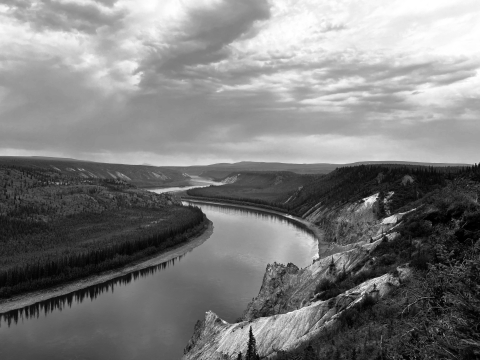 black and white landscape of a river and the boreal forest