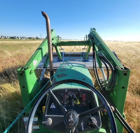 green tractor in an open field