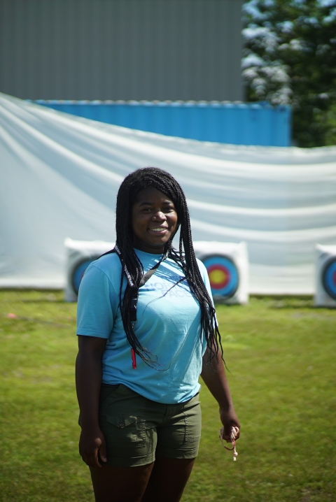 woman standing by archery targets