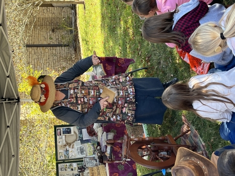 Kids watching a primitive demonstration