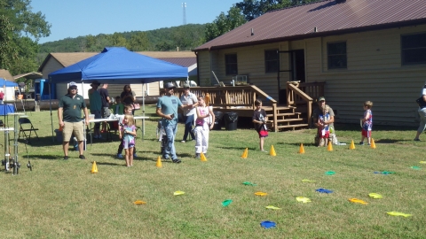children participating in lawn fishing at the hatchery outdoor adventure