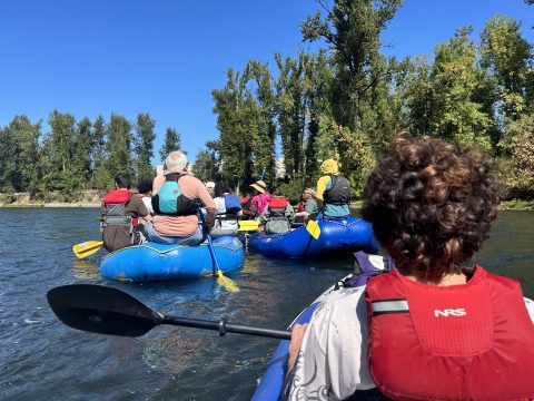 A group of high school students and adults float on Oregon's Clackamas River