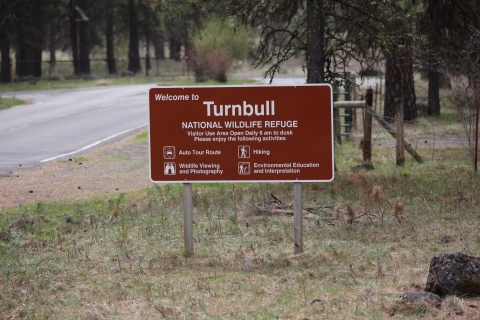 Brown sign with white text