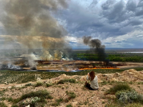 Refuge manager watches a prescribed burn on Ouray NWR
