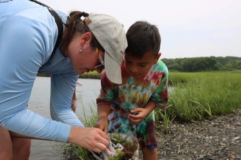 Mystic Tribal youth camper and April Alix at salt marsh