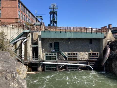 A hydropower dam on a river with an elevator for fish