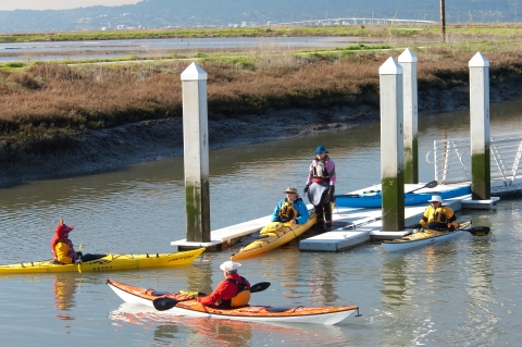 Five paddlers use a new kayak launch at Eden Landing on south San Francisco Bay.