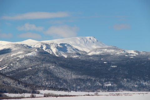 A snowy wintery mountain landscape is shown.