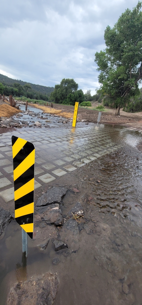The new road crossing made of better materials, has improved road warning signage, and streambank enhancement throughout the stream.