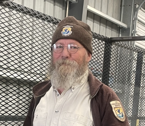 Biological Technician Glenn Martin working on mobile aviary.