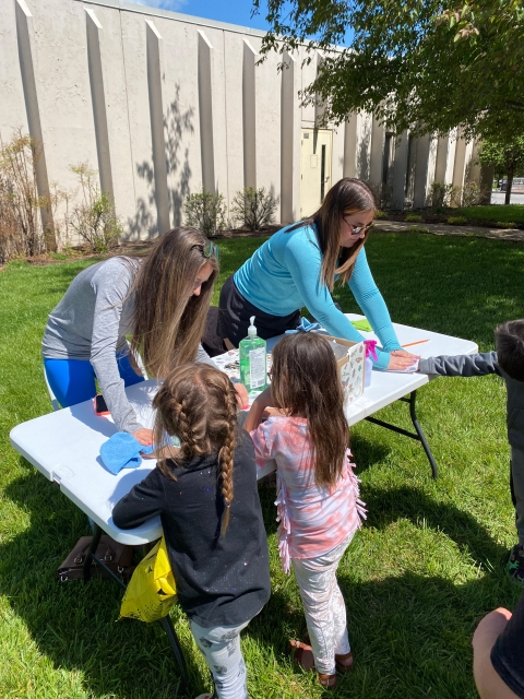 children getting temporary tattoos at the earth day event