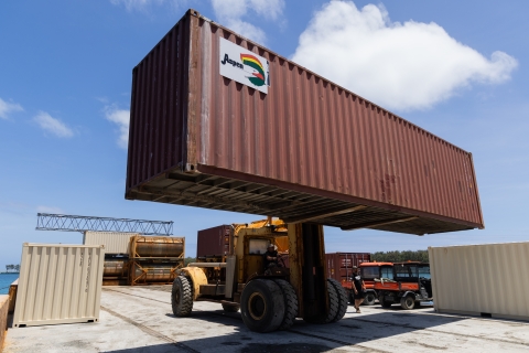 Offloading container with helicopter inside