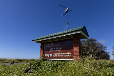 Helicopter above refuge sign