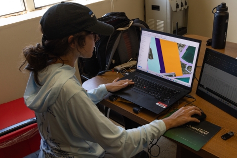 Team member managing GIS flight tracking data