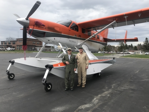 Two pilots standing next to a plane. Maine and Atlantic Canada survey crew for 2019, Biologist/Pilot, Mark Koneff, and Biologist/Observer, John Bidwell, in front of Quest Kodiak Amphibian N769