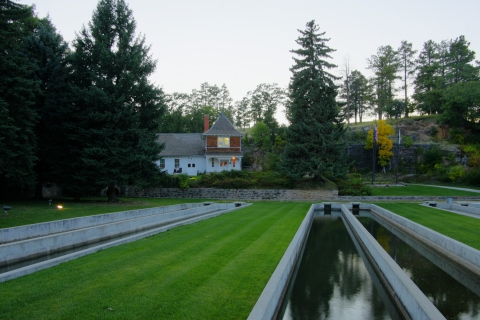 Scenery shot in summer of the hatchery raceways and historic 1899 fish hatchery building.