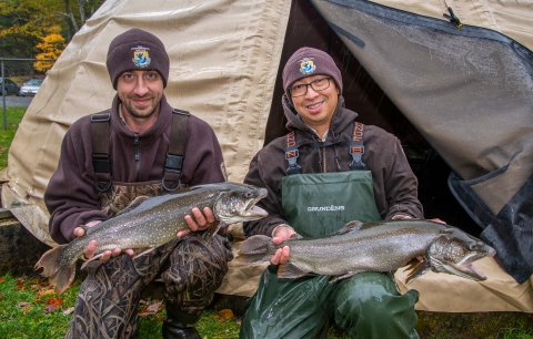 Lead Biologist Brian Layton and Biological Science Technician Joseph Xamountry showcasing two adult Lake Trout 
