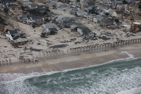 Aerial photo of damaged homes along New Jersey shore.