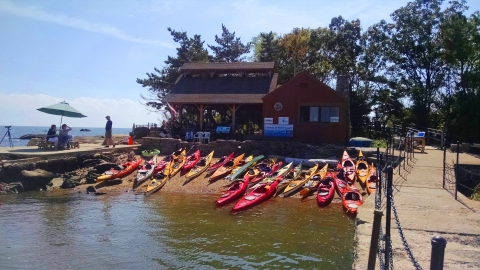 Colorful kayaks and education pavilion at the Outer Island Unit, Branford