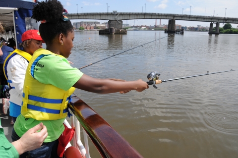 Young person fishing, Anacosta River, Washington, D.C. 