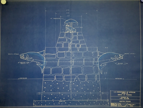 A blueprint of a fountain design features a stone pillar with two salmon figures jumping out of each side and a mushroom with a frog underneath it on the top.
