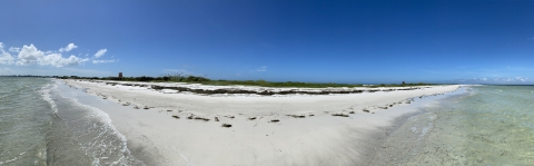 Panorama view of Passage Key with blue sky and sandy beach
