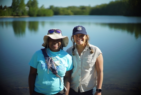 two women by a lake