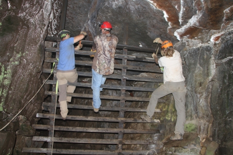 Construction of a cave gate at Devil's Den State Park
