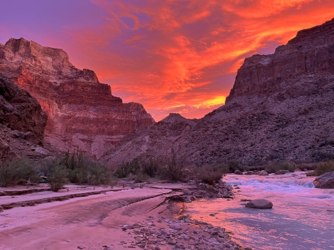 A vivid orange and purple sunrise on the Little Colorado River