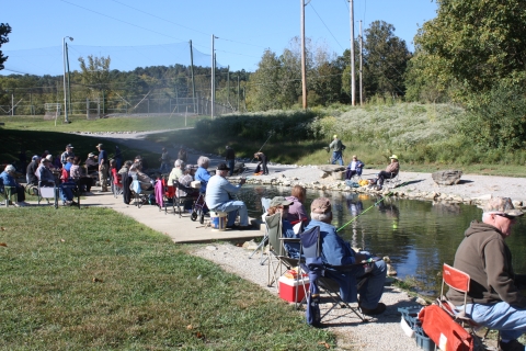 Hatchery Creek lined with anglers fishing at Wolf Creek National Fish Hatchery